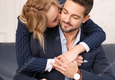 depositphotos_118744382-stock-photo-young-businesswoman-kiss-businessman-neck